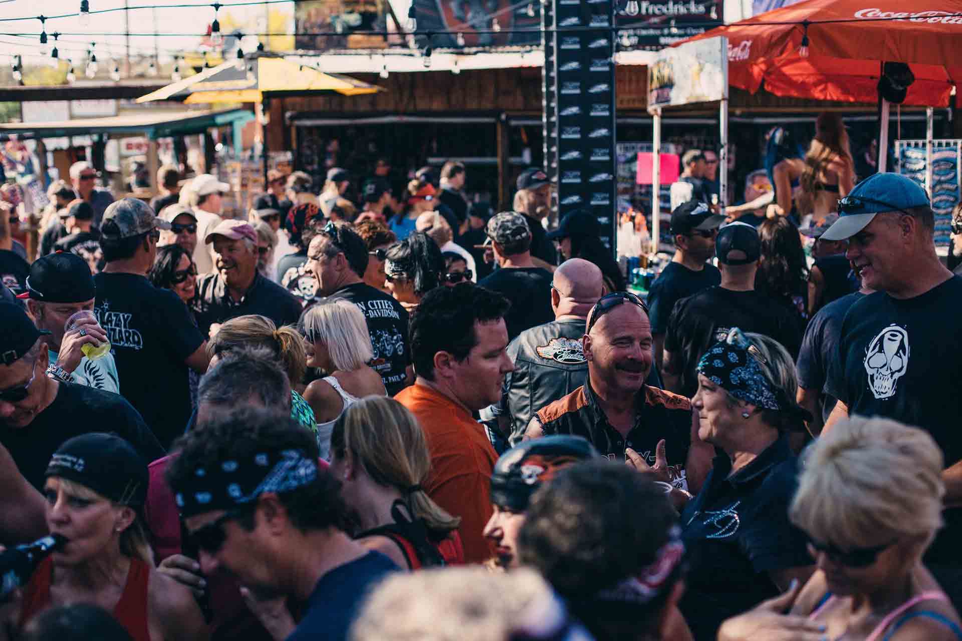 Crowd gathered outside The Hideaway Grill and Cave Creek Roadhouse